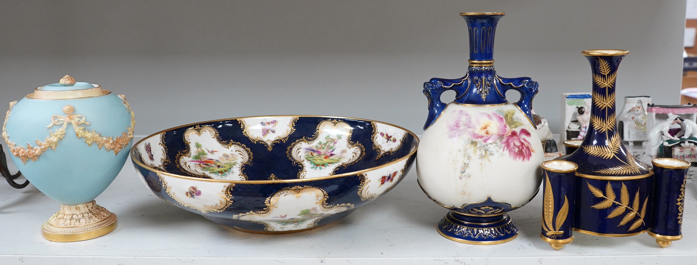 A large Royal Worcester dish, Johnson/Rogers, two Worcester vases, a bowl and a Worcester jar and cover, tallest vase 22cm high. Condition - some chips and gilt decoration worn